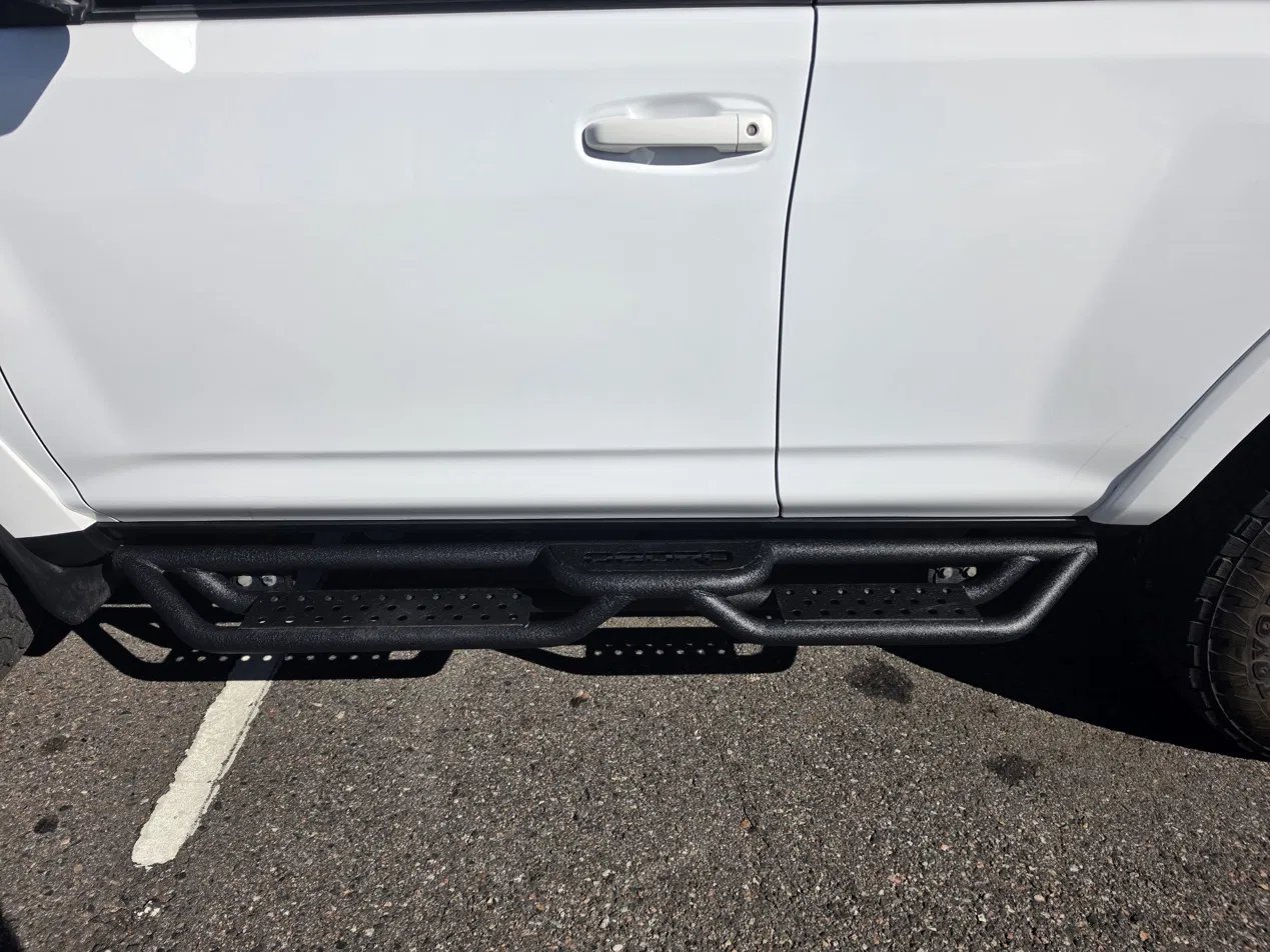 Close-up of drop-step running board under 4Runner doors